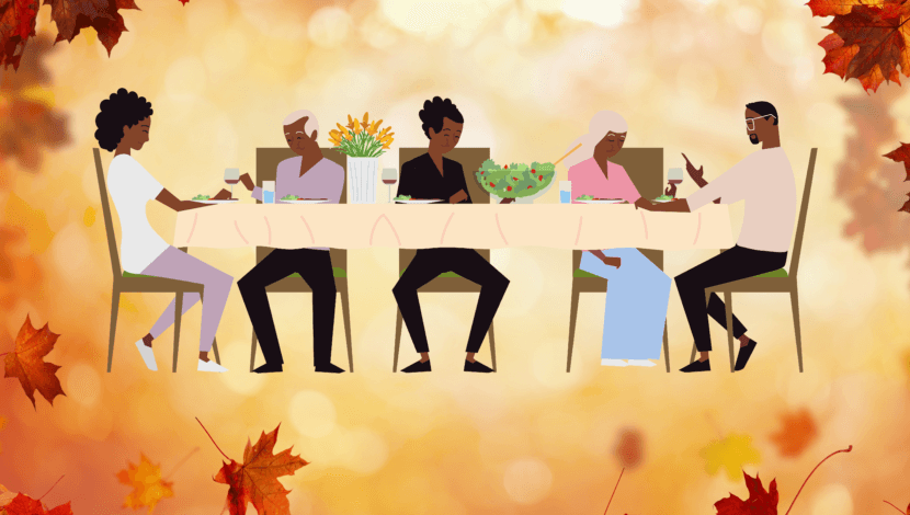 5 people at a dinner table, plus autumn leaves
