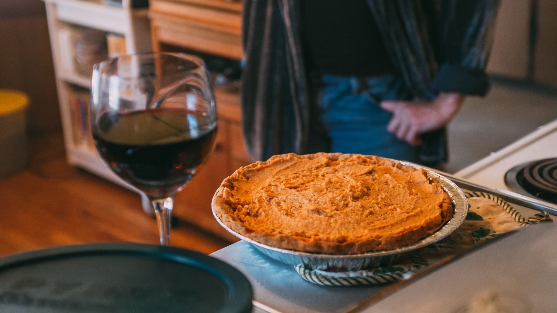 thanksgiving pumpkin pie and a glass of wine