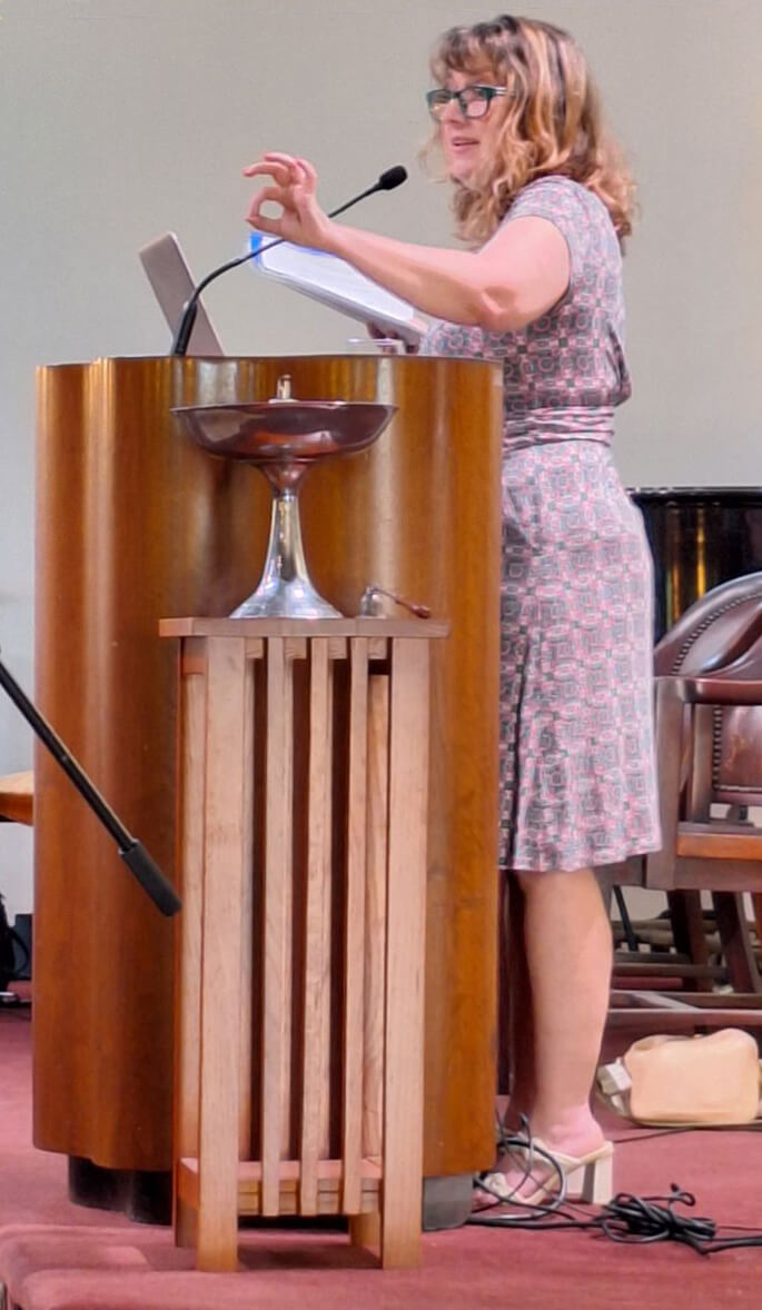 Eileen at the podium at the 2024 Annual Meeting