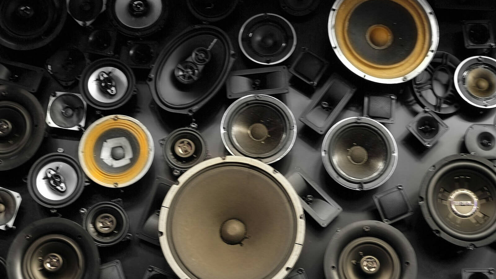 a wall full of different types of speakers