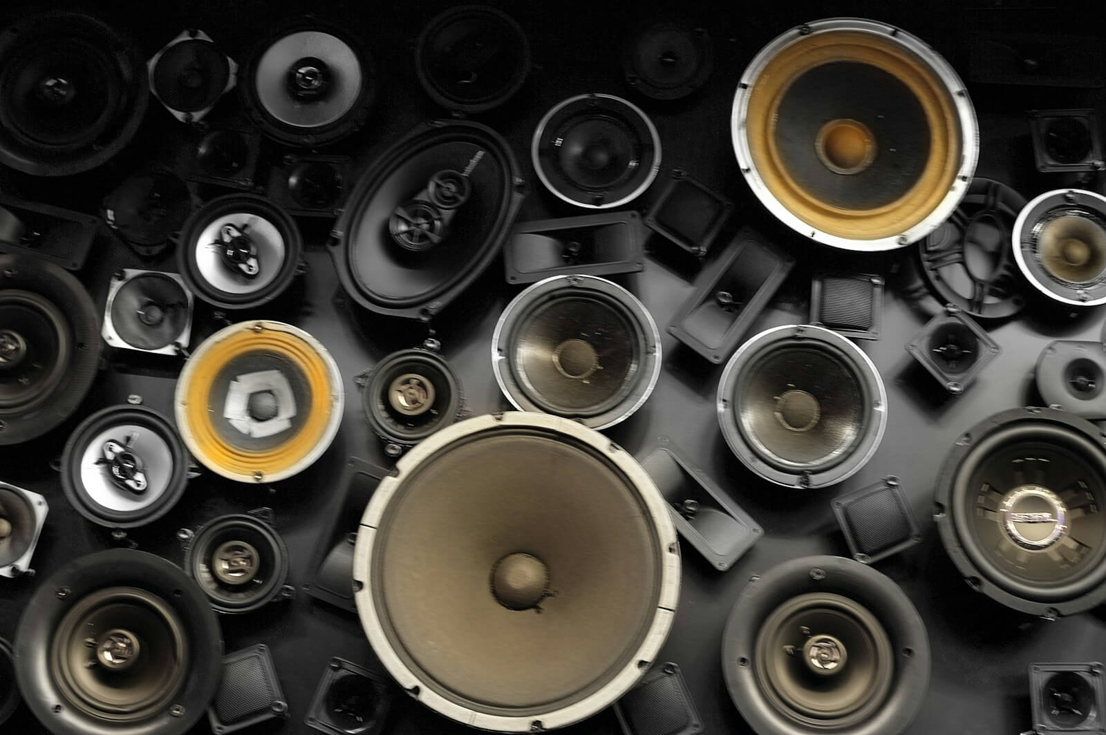a wall full of different types of speakers