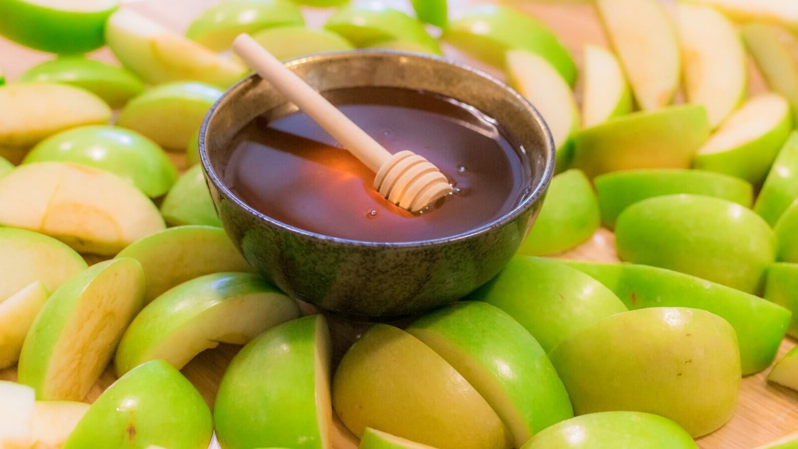 brown wooden spoon on green round fruit