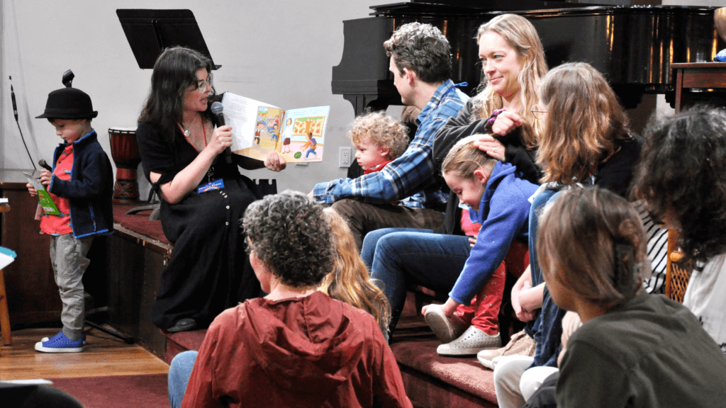 Children and families listening to storytelling