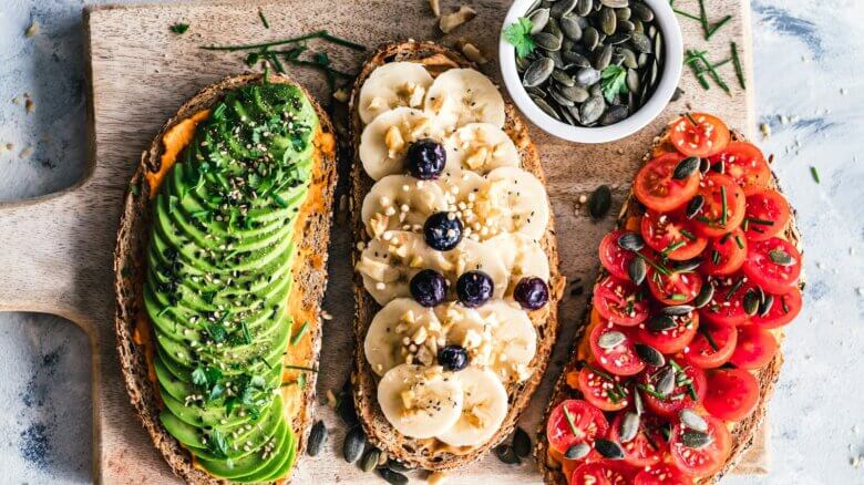 assorted fruits and vegetable on brown wooden chopping board