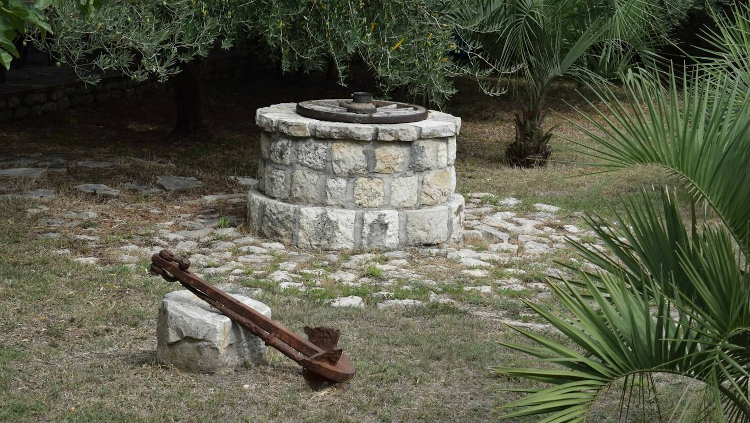 a stone fireplace in a garden
