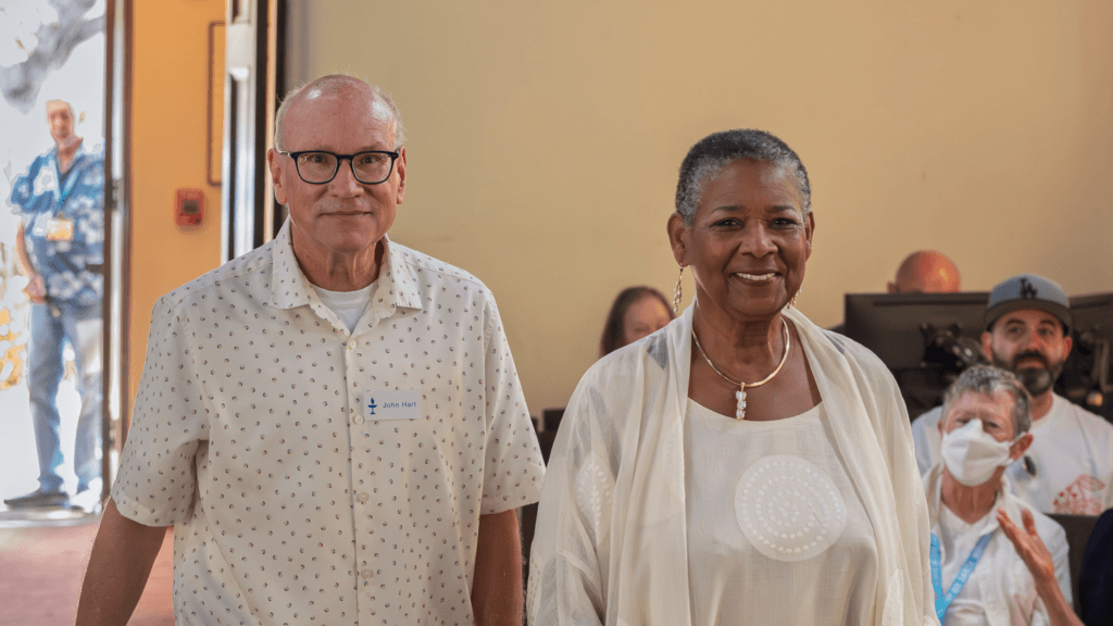 Worship Associate John Hat and Rev. Kikanza Nuri-Robins entering the sanctuary